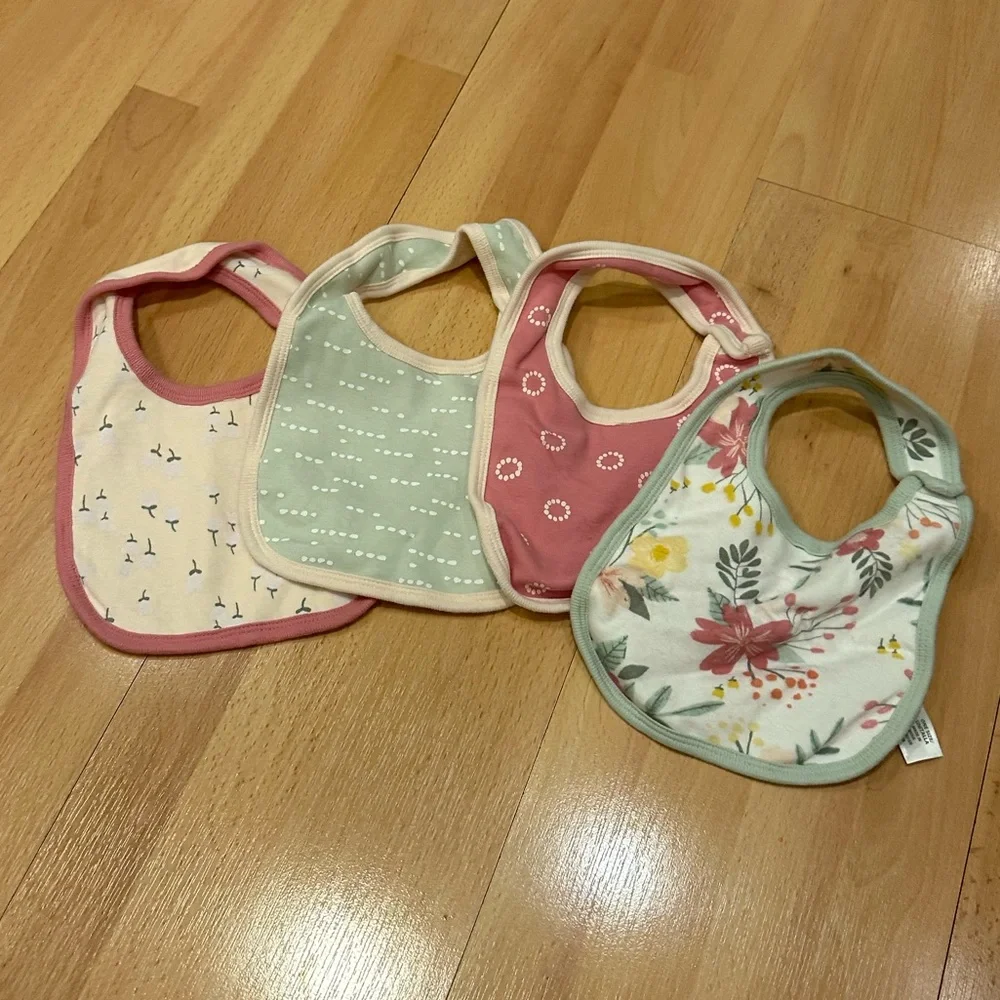 Set of four girls patterned cloud island bibs